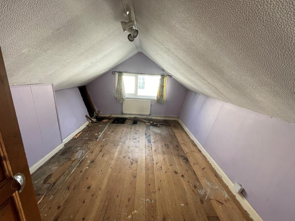 Lot: 88 - FIRE-DAMAGED DETACHED BUNGALOW - Loft room showing fire damage